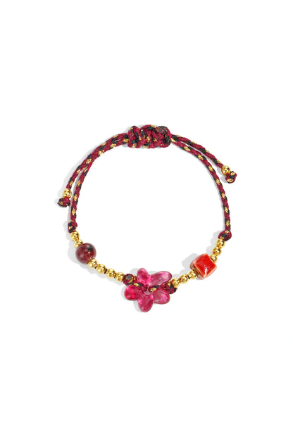 Kralenarmband met bloem