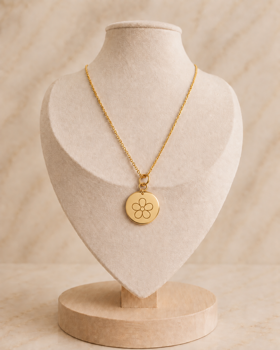 Goudkleurige RVS ankerketting met ronde bedel en bloemsymbool